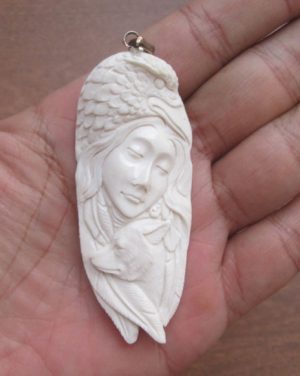 Goddess Raven Wolf Carved Bone Pendant
