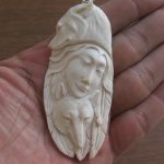 Goddess Wolves Carved Bone Pendant