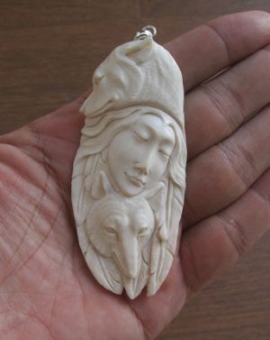 Goddess Wolves Carved Bone Pendant