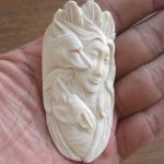 Goddess Wolves Carved Bone Pendant