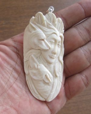 Goddess Wolves Carved Bone Pendant