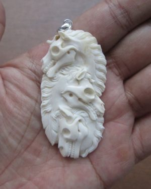Horse Skull Group Carved Bone Pendant